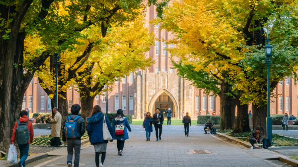 Students walking on a college campus.