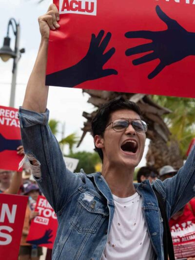 Image of a person holding a protest sign