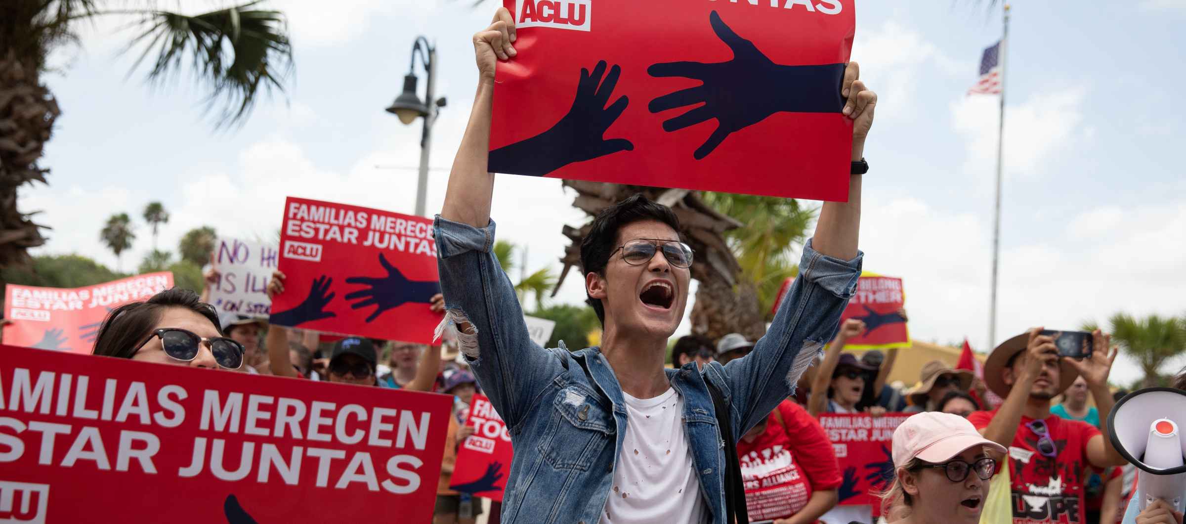 Image of a person holding a protest sign