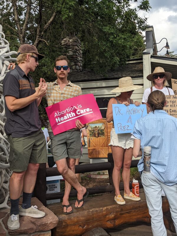 Image of a person holding a protest sign
