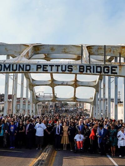Demonstrators including Vice President Kamala Harris march on the Edmund Pettus Bridge on the anniversary of "Bloody Sunday" on Sunday, March 6, 2022.
