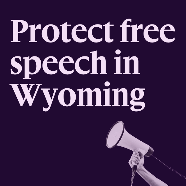 Purple graphic with an image of a hand holding a megaphone and text that says "Protect free speech in Wyoming"