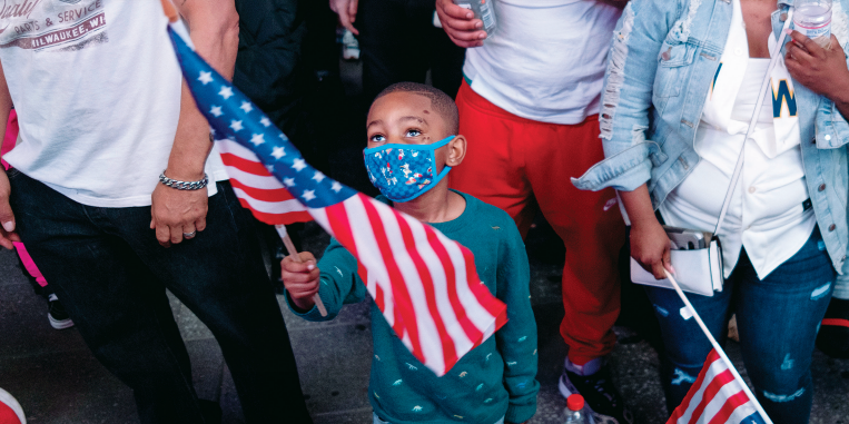 Image of a child holding a flag