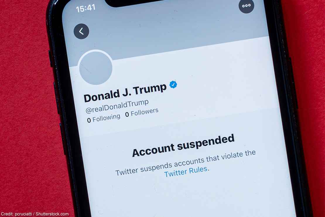 A smartphone showing Donald J. Trump's suspended Twitter account.