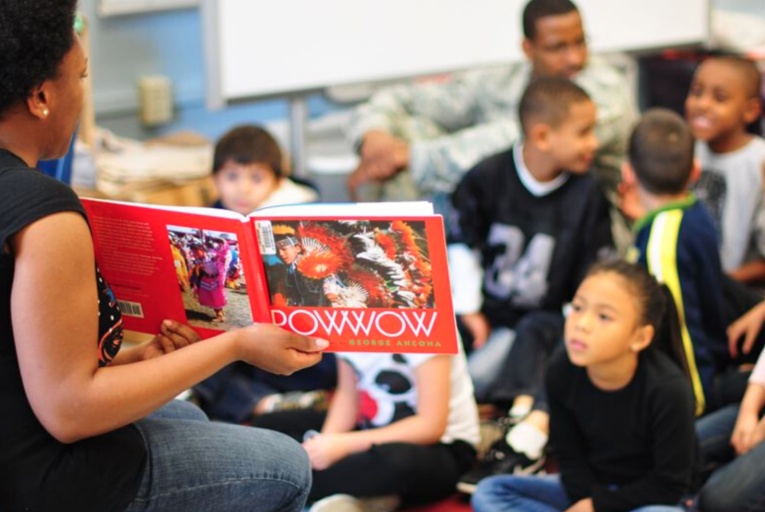 Students learning about Pow Wows