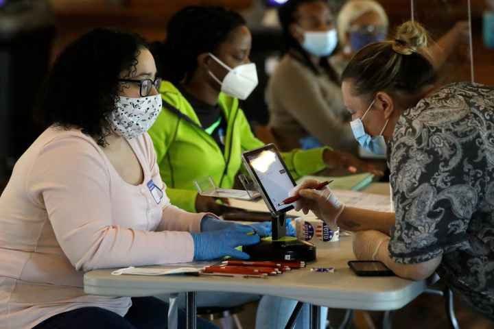 Image of poll workers