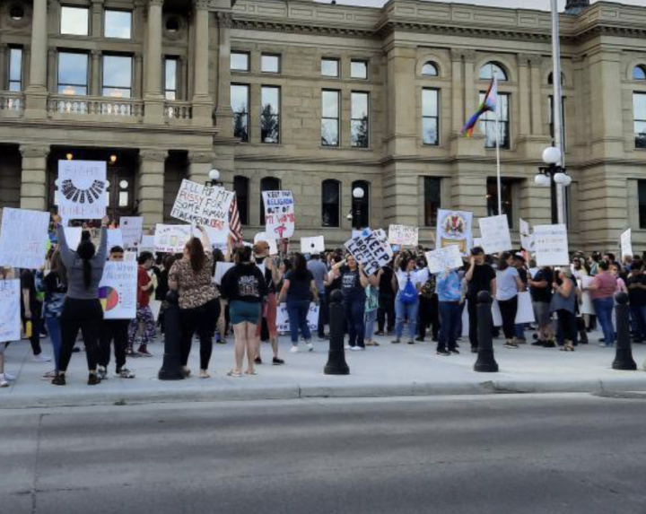 image of people protesting at the capitol in Cheyenne