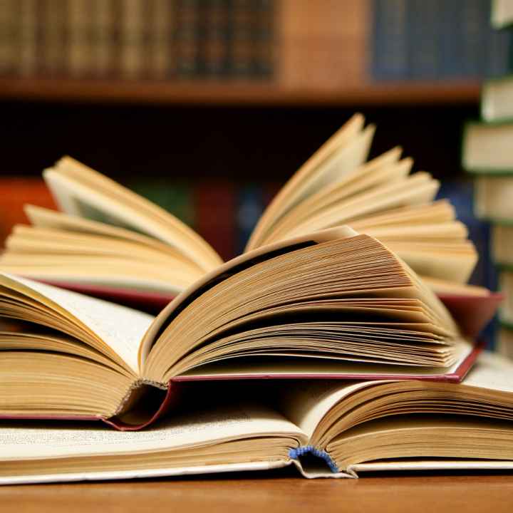 An open book on a table An open book on a table