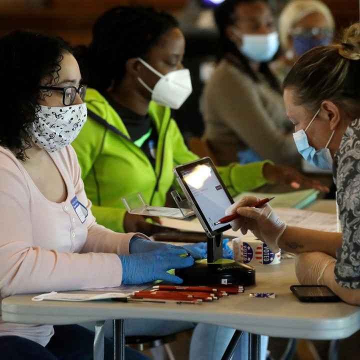 Image of poll workers