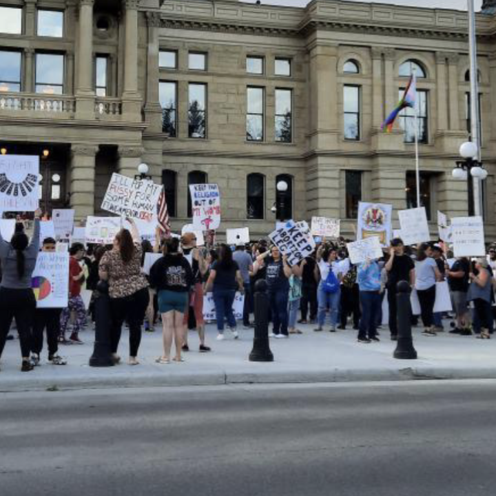 image of people protesting at the capitol in Cheyenne